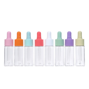 Venta al por mayor, contenedor dispensador de líquido cosmético vacío reutilizable, tubo de vidrio para cuerpo de PET, Mini botella cuentagotas colorida de 20ml 