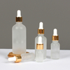 Essential oil round frosted clear glass aluminum shiny gold dropper bottle